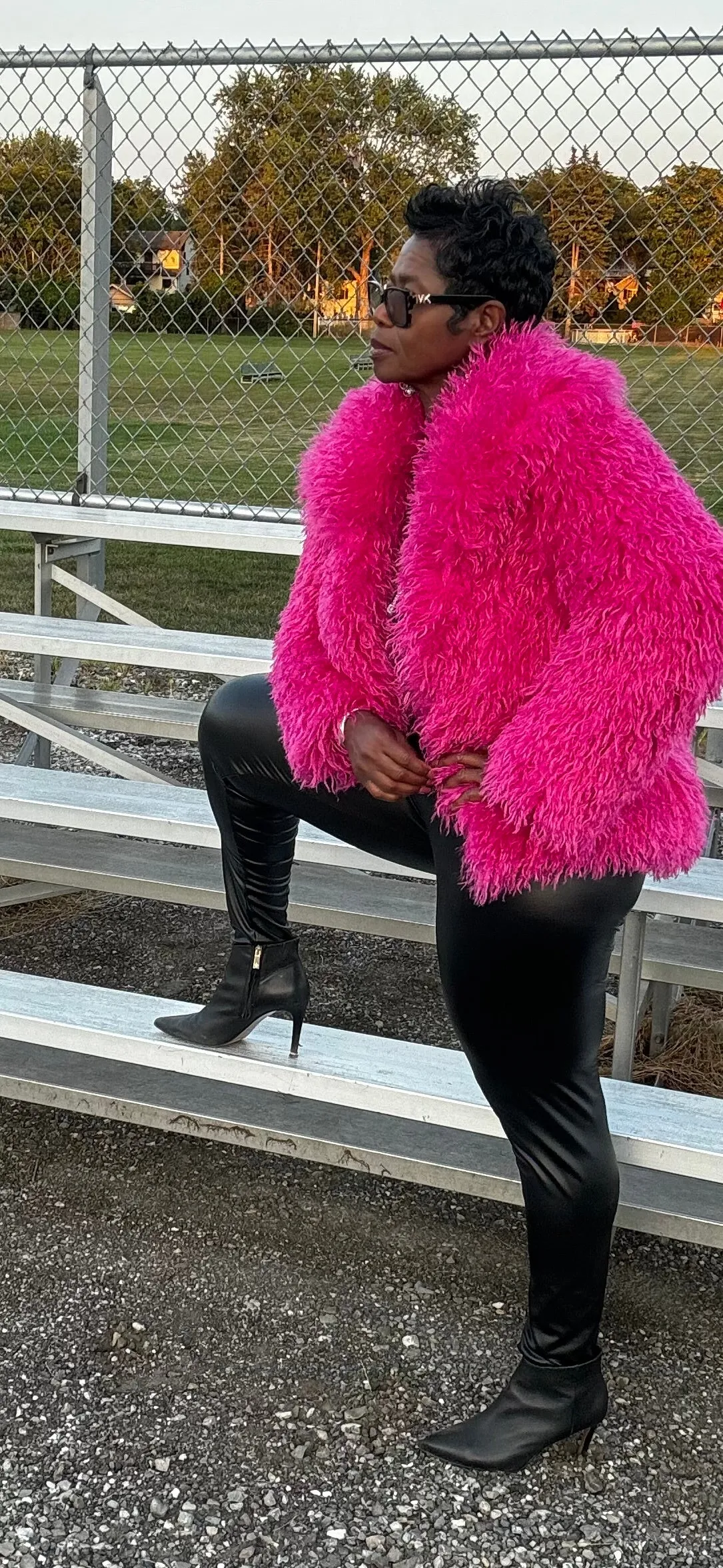 Tasha has a pink furry jacket