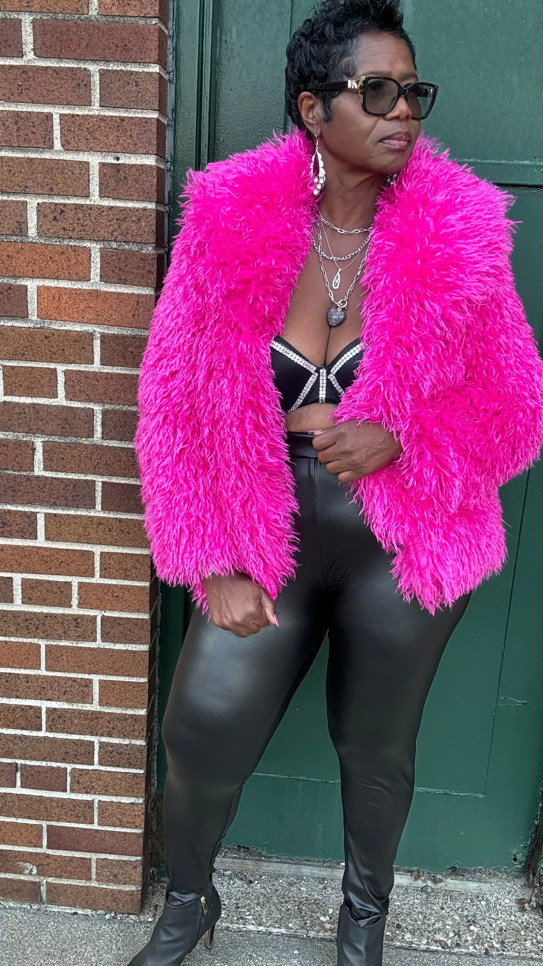 Tasha has a pink furry jacket