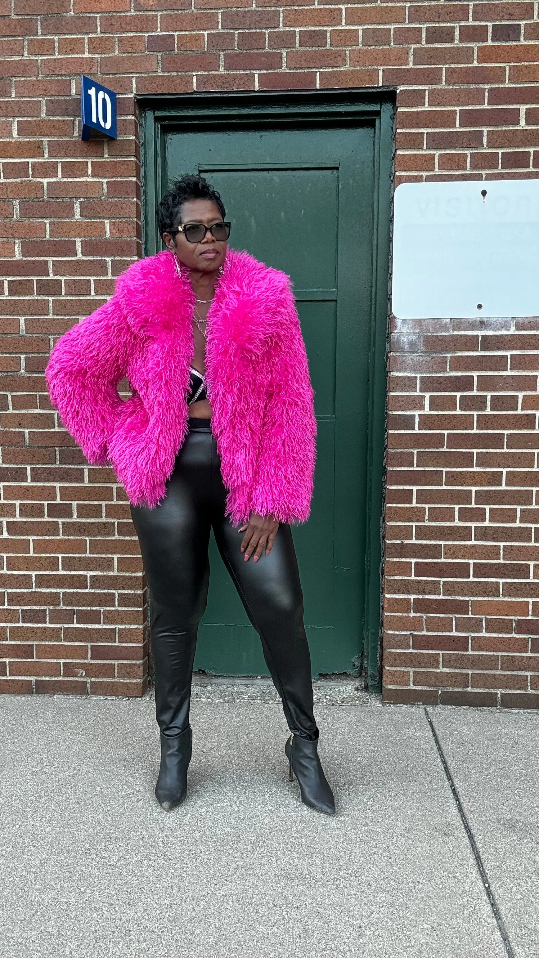 Tasha has a pink furry jacket