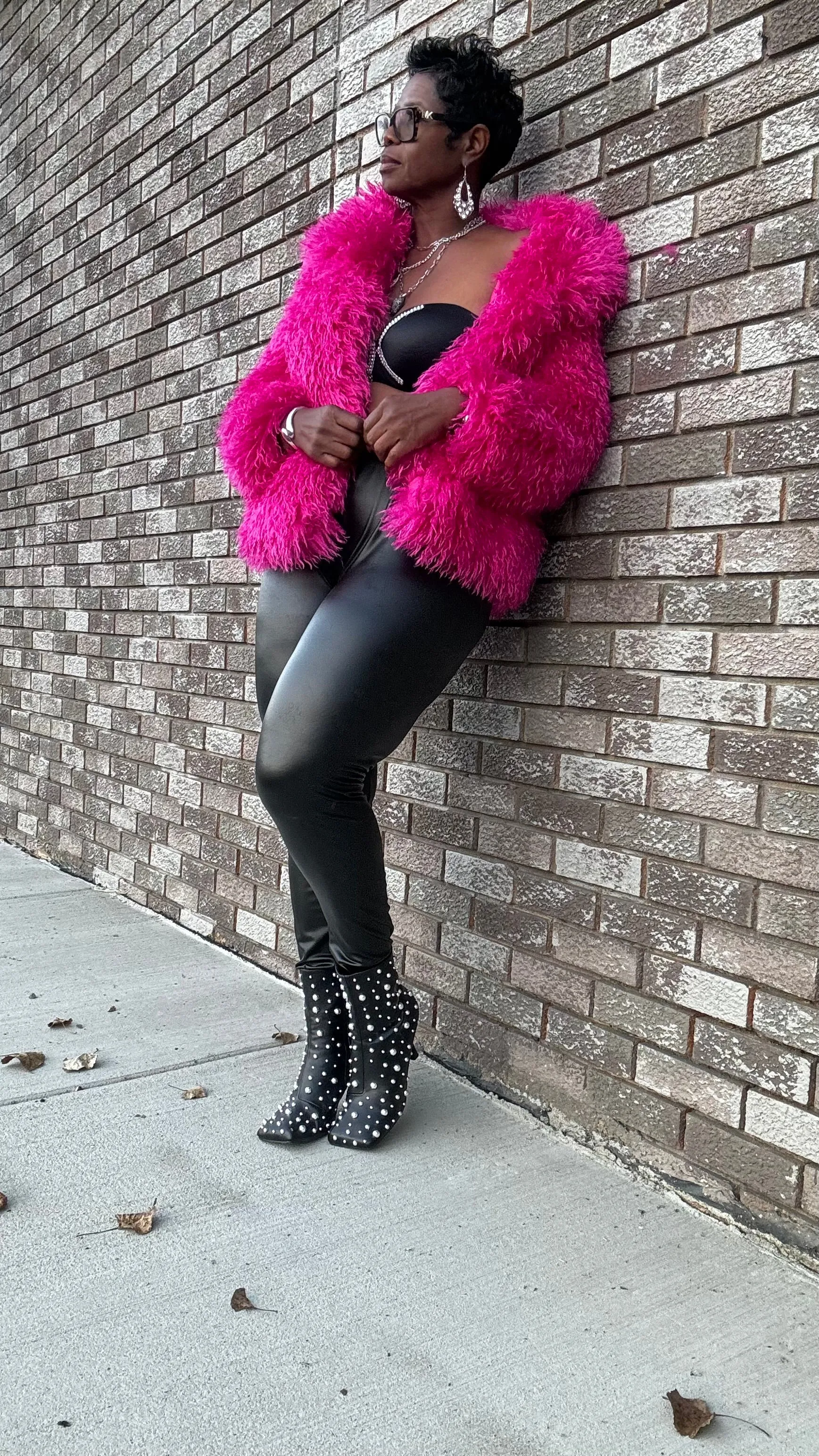 Tasha has a pink furry jacket