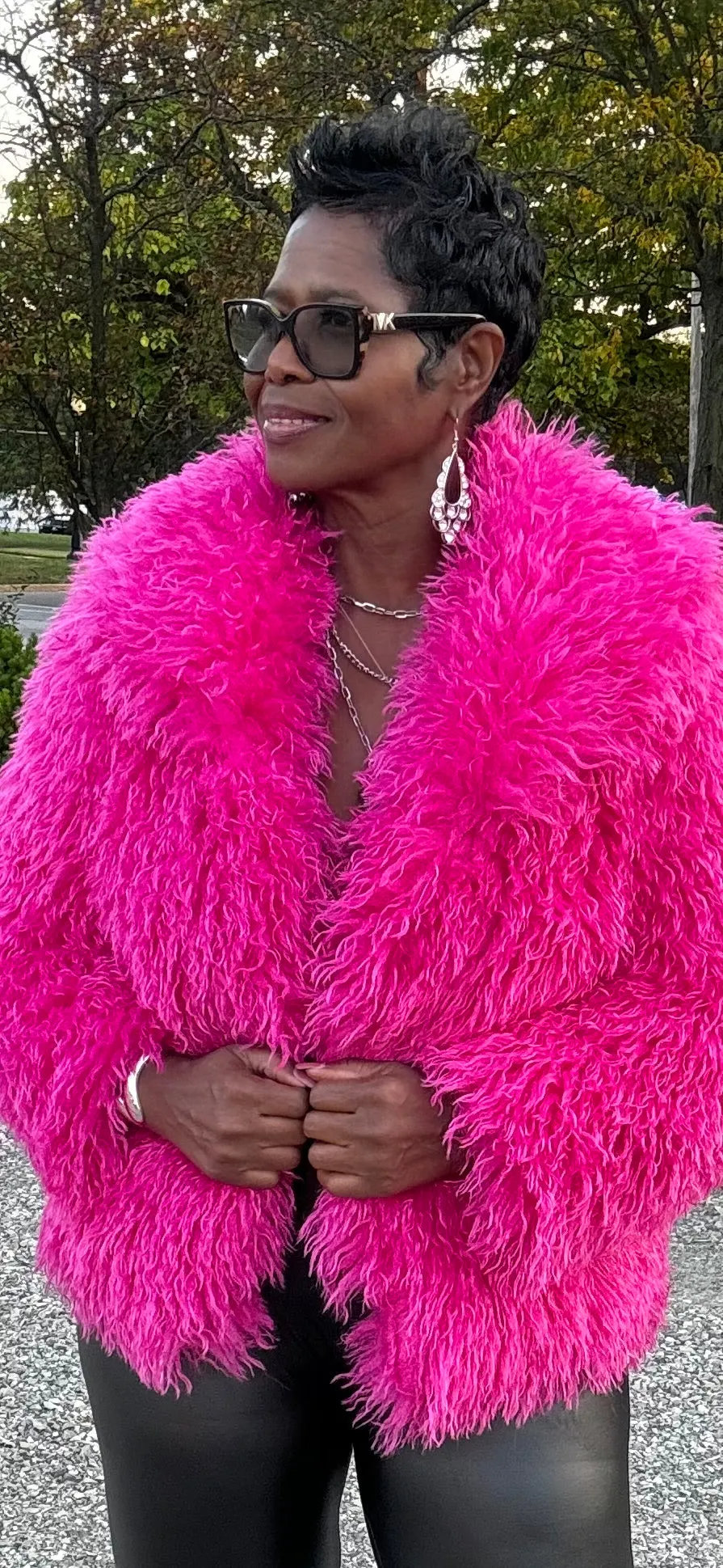 Tasha has a pink furry jacket